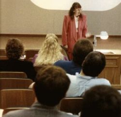 Shirley Fine Lee lecturing in corporate auditorium